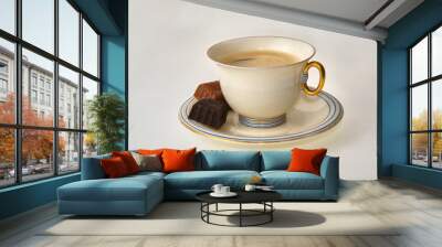 Coffee cup and pralines on a white background decorative art style with golden handle set of cup and saucer with two choclate pralines Wall mural