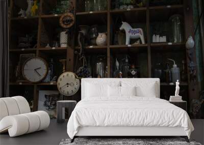 Bangkok, Thailand - Jun 26, 2020 : Wall clocks and Collectibles on handmade wooden rustic wall shelf in Living room Vintage style. No focus, specifically. Wall mural