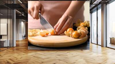 Cape gooseberry or golden berry (Physalis peruviana) cutting on wooden board, Healthy tropical fruit Wall mural