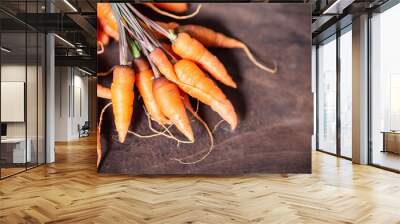 Fresh carrots on wooden background, organic vegetable Wall mural