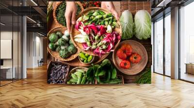 Fresh organic Southeast Asian vegetables and edible flowers from local farmer market, Northern of Thailand, Sustainability concept, Top view Wall mural