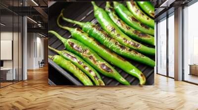 Grilled green chili pepper on grill pan preparing for Northern Thai food (Nam Prik Num) Wall mural