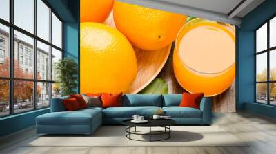 Navel orange fruit and juice on wooden background Wall mural