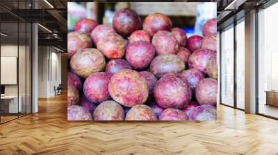 Ripe passion fruit for sale in a market stall near the street,Chiangmai,Thailand Wall mural