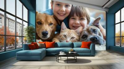 A smiling boy takes a selfie with a pet cat and dog Wall mural