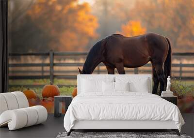 Horses in an autumn meadow, surrounded by colorful leaves and pumpkins Wall mural