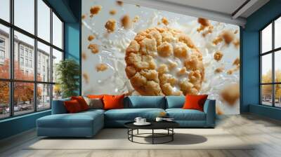 A crispy cookie dunked in a pool of milk, creating a delightful splash of cream and crumbles. Wall mural