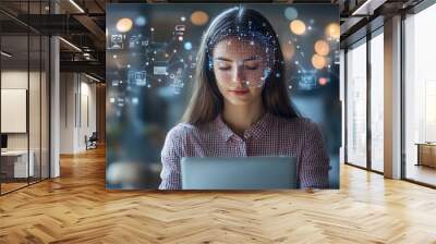 A woman is sitting in front of a laptop with a digital face scan overlay. She is in a modern office with a blurred background. Wall mural