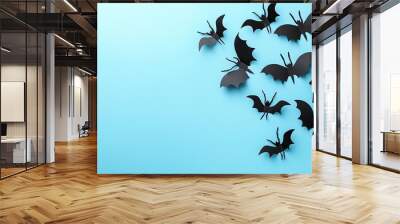 Halloween pumpkin with bats on a blue background. Wall mural