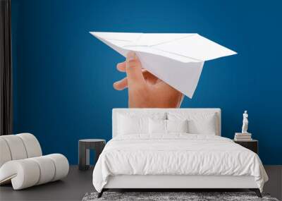 paper plane in hand isolated on blue background - clipping paths. Wall mural