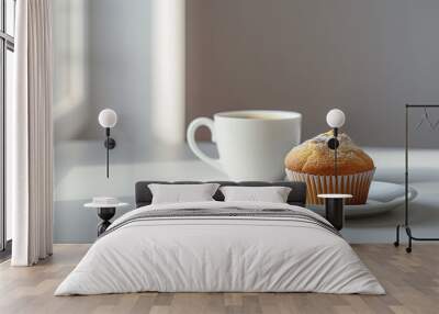 A cup of steaming coffee and a delicious muffin on a table. Wall mural