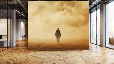 A man walks in a desert with a sky full of dust Wall mural