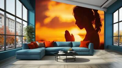 Silhouette of a woman paying respects and praying A symbol of gratitude to the Lord. Wall mural