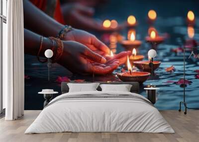 Person holding lit gold candle in calm water, peaceful and elegant scene Wall mural