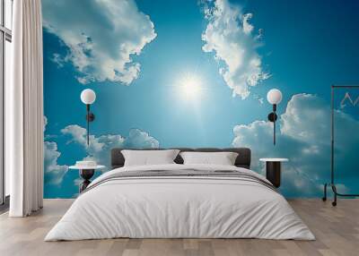 Blue sky background with white clouds and sun Wall mural