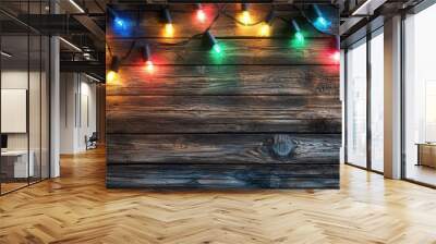 A wooden background with a string of Christmas lights Wall mural