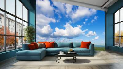 Blue sky background with clouds Wall mural