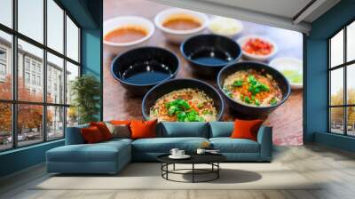 Suki Sauce is a chili sauce suki asia style food. Jaew Dipping sauce as Thai spicy dipping and Ponzu sauce are served with fresh chopped chili and minced garlic in Sukiyaki, Shabu or grill restaurant. Wall mural