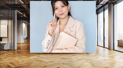 The Asian female executive has successfully built a diverse leadership team within our company, reflecting her belief that varied perspectives enhance business decision-making and drive success. Wall mural