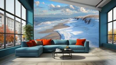 a beautiful winter beach scene with snow on the sand and waves crashing on the shore. Wall mural