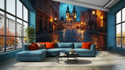 Beautiful night view of an illuminated historic European city square with cobblestone streets and a dramatic cathedral in the background. Wall mural