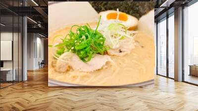 Japanese food concept. Tonkotsu Ramen with seaweed, pork, boiled egg, and green onion in a bowl.  Close up. Wall mural