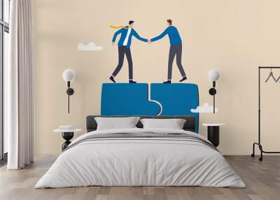 Collaborate, cooperate or partnership and agreement to help business success, together or teamwork support each other concept, success businessmen finish deal and handshake on jigsaw puzzle. Wall mural