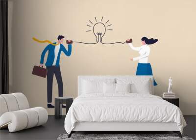 Communicate idea, advice or solution, good communication skill for business success, brainstorm or discuss in meeting concept, smart businessman talk to colleague on phone line with lightbulb symbol. Wall mural