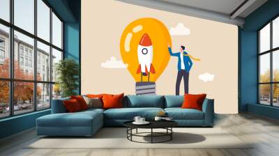 Entrepreneurship, setting up new business, motivation to create new business idea and make it success concept, businessman start up company owner standing with innovative rocket inside lightbulb idea. Wall mural