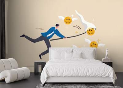 Pursuit of happiness, finding true life success, positive thinking or optimistic, feeling bless, humor or joyful concept, cheerful man catch smiling face with butterfly net metaphor of happiness. Wall mural