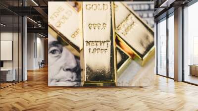 Shiny gold bullions ingot stack on america US dollar banknote money as financial asset, investment and wealth concept Wall mural