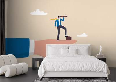 Vision to see business direction, economic forecast or future, strategy to success or business objective, career path concept, businessman on giant pointing finger with telescope to see vision. Wall mural