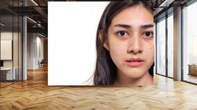 Asian woman gets freckles, blemish, pimple and dull skin on her face. Attractive beautiful Asia woman get eye dark circles, She get no makeup on face. She look unhappy. isolated on white, copy space Wall mural