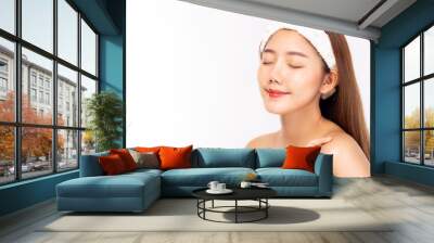 Attractive beautiful young asian woman close eyes with happy and smile face. Charming beautiful young female has beauty facial skin. beauty skin care, spa concept with white background, copy space Wall mural