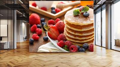 Mixed berry pancake with honey on wooden table Wall mural