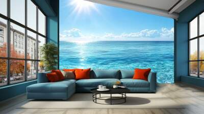 A tranquil ocean landscape featuring clear blue waters and a bright sun illuminating the horizon, perfect for relaxation. Wall mural