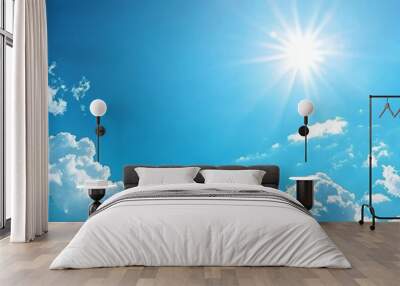 A vibrant blue sky with fluffy clouds and a bright sun casting warm rays, perfect for conveying peace and tranquility. Wall mural