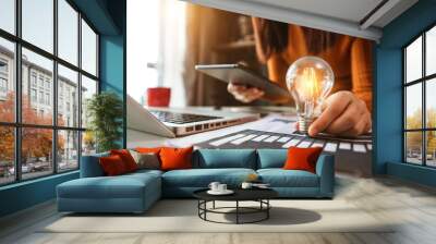 business hand showing creative business strategy with light bulb as concept Wall mural