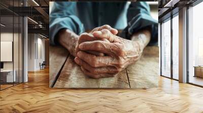 close up of elderly oldman hands on wooden table Wall mural