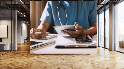 Medical technology concept. Doctor working with mobile phone and stethoscope in modern office Wall mural