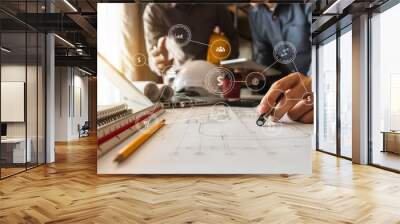 Two colleagues discussing data working and tablet, laptop with on on architectural project at construction site at desk in office Wall mural