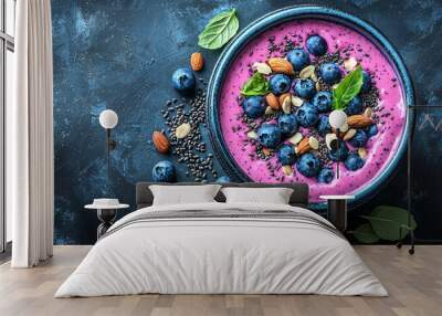 Vibrant smoothie bowl topped with fresh blueberries, almonds, and seeds, perfect for a healthy breakfast or snack. Wall mural