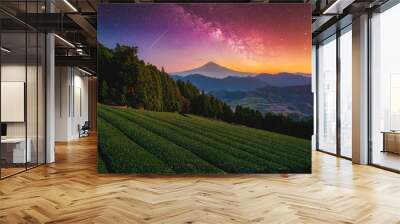 Landscape with Milky way galaxy. Mt. Fuji over green tea field with autumn foliage and milky way at sunrise in Shizuoka, Japan. Wall mural