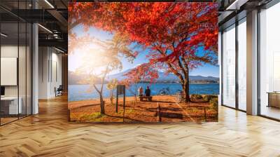 Mt. Fuji over Lake Kawaguchiko with autumn foliage and couple love at sunrise in Fujikawaguchiko, Japan. Wall mural