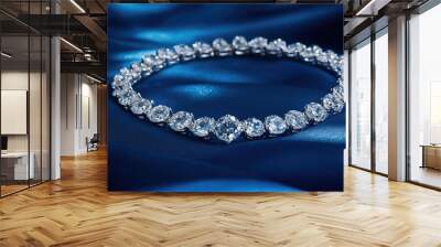 A beautiful diamond necklace placed on a rich blue background, captured from above, with each gemstone reflecting light and enhancing its luxury Wall mural