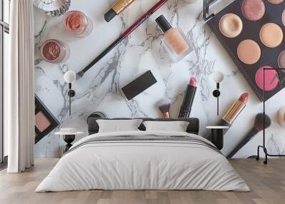 A flat lay of makeup essentials including lipsticks, brushes, eyeshadow palettes, and foundation bottles on a marble background. Wall mural