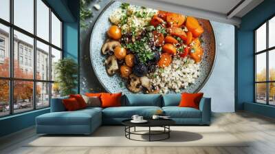 A health-conscious meal featuring black garlic as a garnish, placed next to fresh vegetables and grains on a modern plate. Wall mural