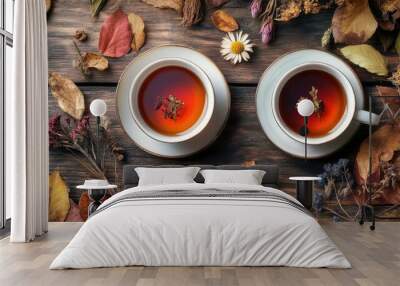 A serene autumn background with two tea cups filled with Chernobrovtsi-infused herbal tea, surrounded by dried flowers and rustic wooden elements, promoting the health benefits of herbal remedies Wall mural