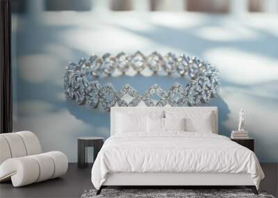 A single diamond bracelet with intricate detailing, resting on a bright white surface, capturing the beauty of luxury jewelry Wall mural