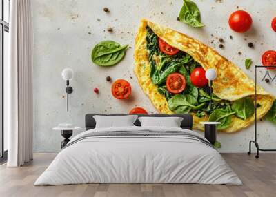 A top view of a stuffed omelette with spinach and tomatoes, laid out on a light stone surface, showcasing the vibrant colors and healthy ingredients, perfect for breakfast photography, Wall mural